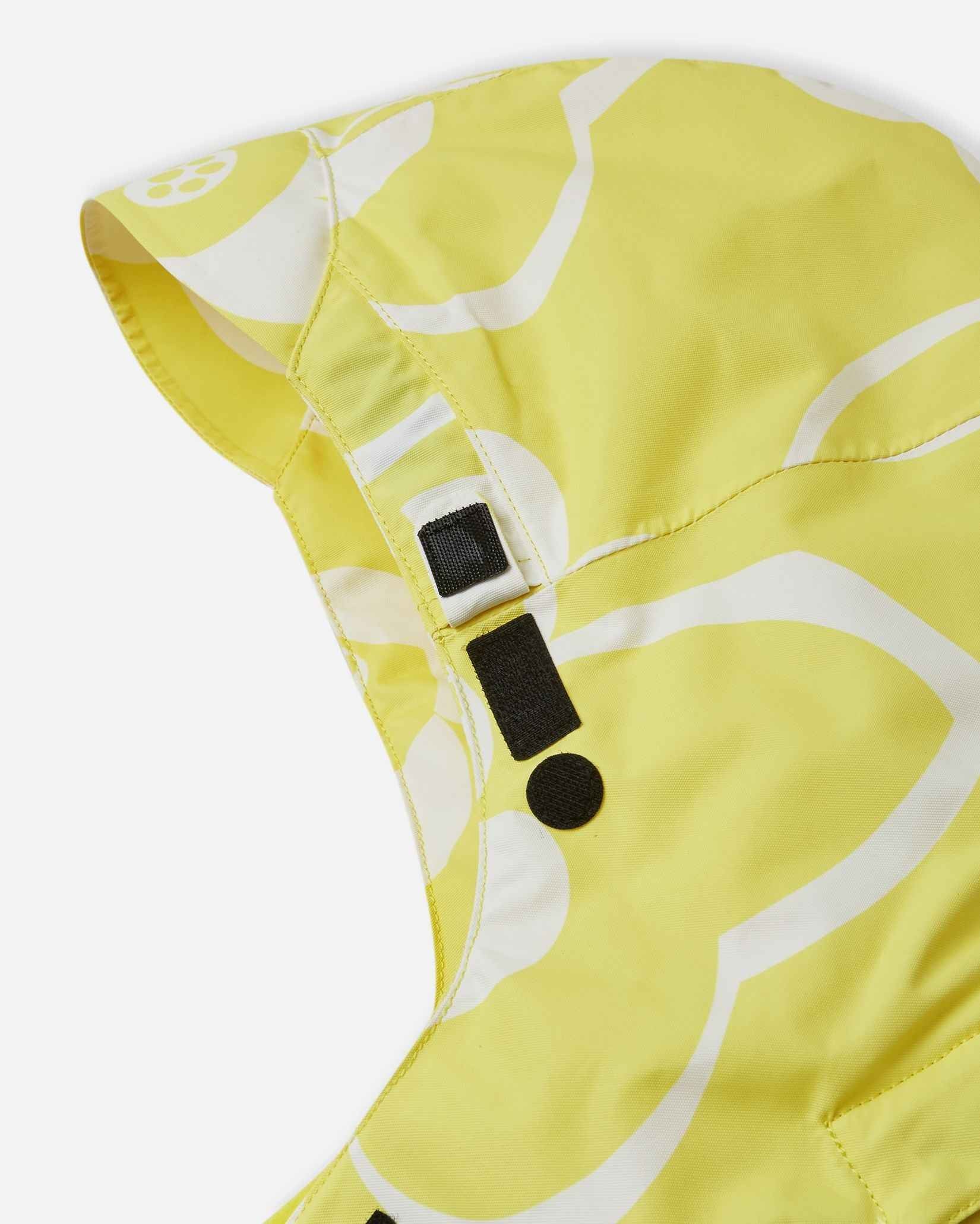 Close-up of the secure velcro hood attachment system on the back collar of the yellow Reima Posio kids' waterproof winter ski jacket.