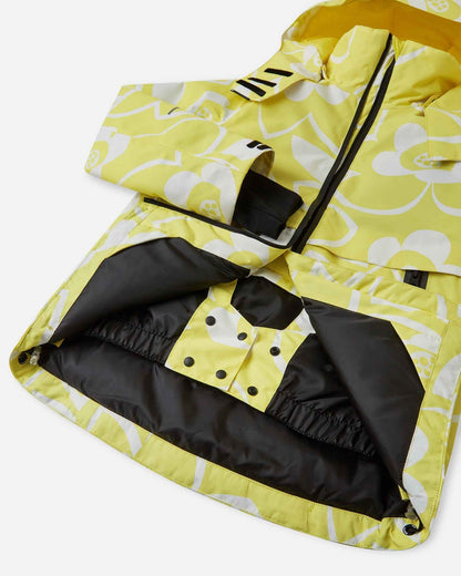 Open front view of the yellow Reima Posio kids' ski jacket, highlighting the internal snap-button powder skirt designed to keep out snow and cold drafts during winter sports.