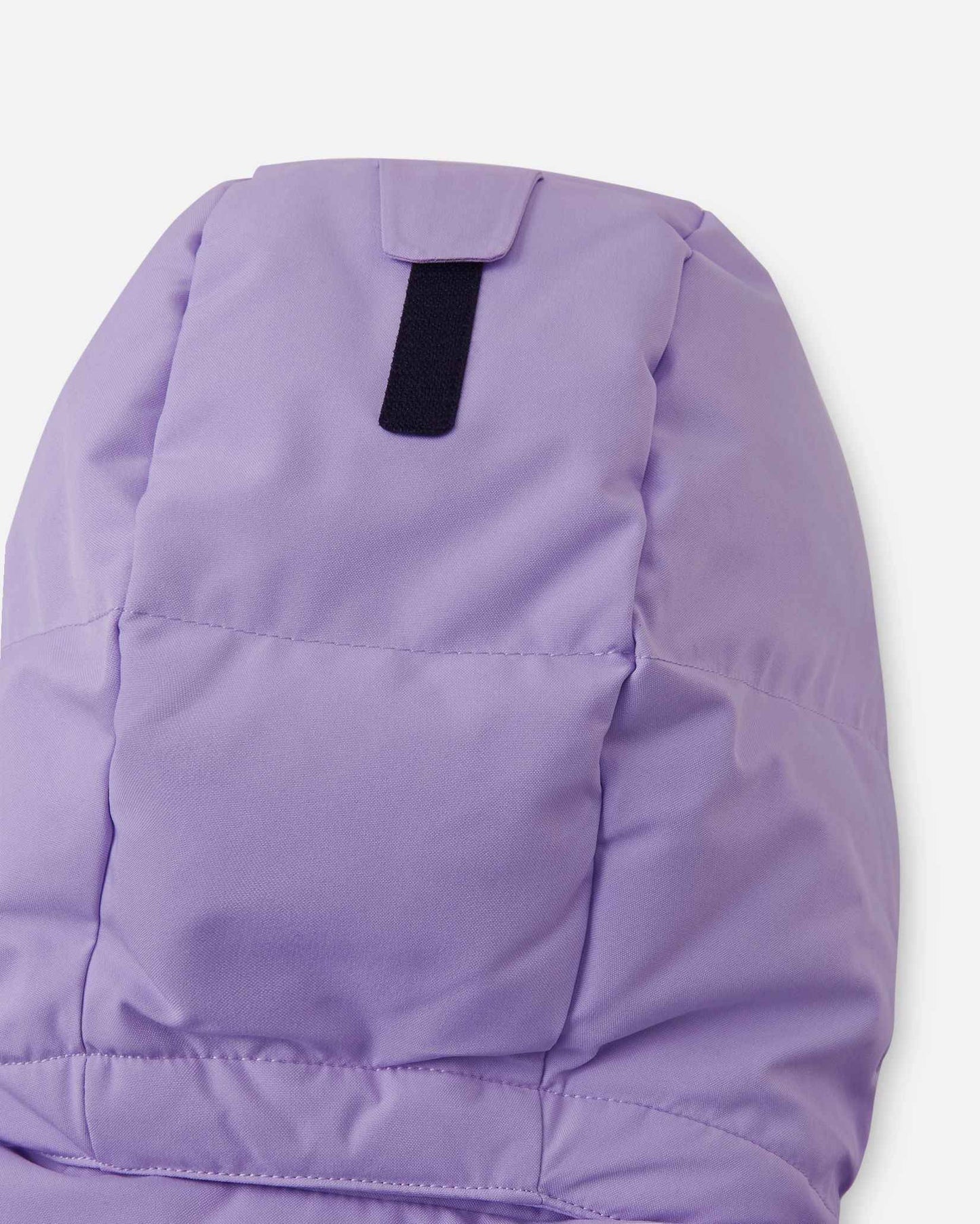 Close-up of the back of the insulated hood on the blooming lilac Reima Ranua kids' down ski jacket, detailing the velcro adjustment tab used to customize the fit for maximum warmth and visibility.