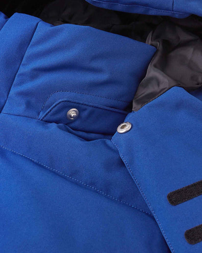 Close-up of the collar area on the Reima Ranua kids' down ski jacket in twilight blue, detailing the secure snap buttons used to attach the safe, easily removable winter hood.