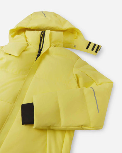 Close-up of the upper half of the Reima Ranua kids' down ski jacket in yellow, detailing the high protective collar, the main front zipper, and adjustable velcro tabs on the insulated hood for a secure fit.