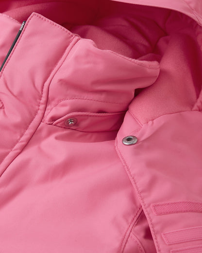 Close-up view of the child-safe snap button attachment on the soft coral Reima Reach ski suit collar, showing the easy-release detachable hood mechanism designed for winter safety on the slopes.