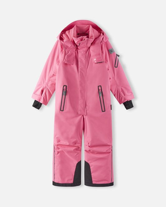 Front view of the highly waterproof Reima Reach kids' winter ski suit in soft coral pink, featuring a durable main zipper, secure chest pockets, and a windproof design for extreme cold-weather protection.