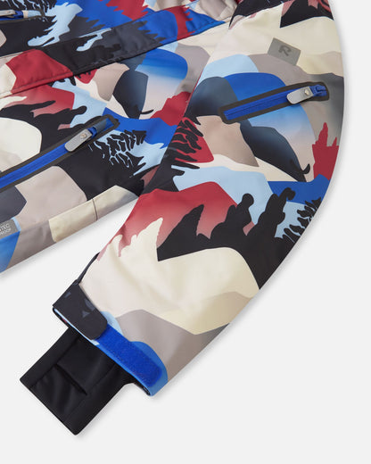 Close-up of the Reima Reach ski suit sleeve in the soft black mountain print, featuring a convenient zippered ski pass pocket on the forearm, an adjustable velcro outer cuff, and a snug inner stretch cuff to lock in warmth and block wind.