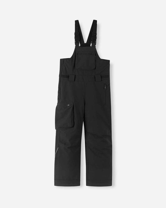 Front flat lay view of the black Reima Rehti kids' winter ski bibs, featuring adjustable buckled suspenders, a convenient zippered chest pocket, multiple utility cargo pockets, and durable waterproof construction for alpine skiing and snowboarding.