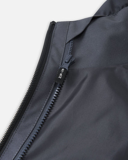 Close-up of the interior zip-in system on the Reima Saarela jacket, which easily attaches compatible mid-layers like the Iisisti fleece jacket for extra warmth.