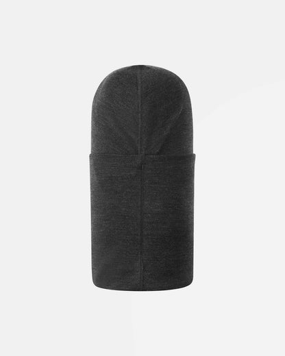 Back flat lay view of the black melange Reima Salassa kids' wool balaclava, displaying the streamlined, form-fitting silhouette and smooth center seam that ensures itch-free comfort during all-day snow activities.