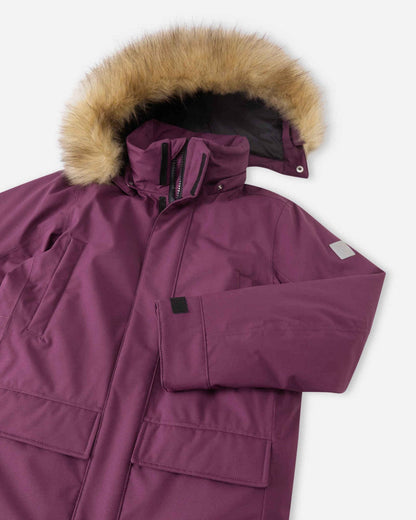 Angled close-up view of the deep purple Reima Serkkula kids' down jacket, highlighting the fleece-lined collar, sleeve with adjustable cuff, chest pocket, and faux-fur hood trim.