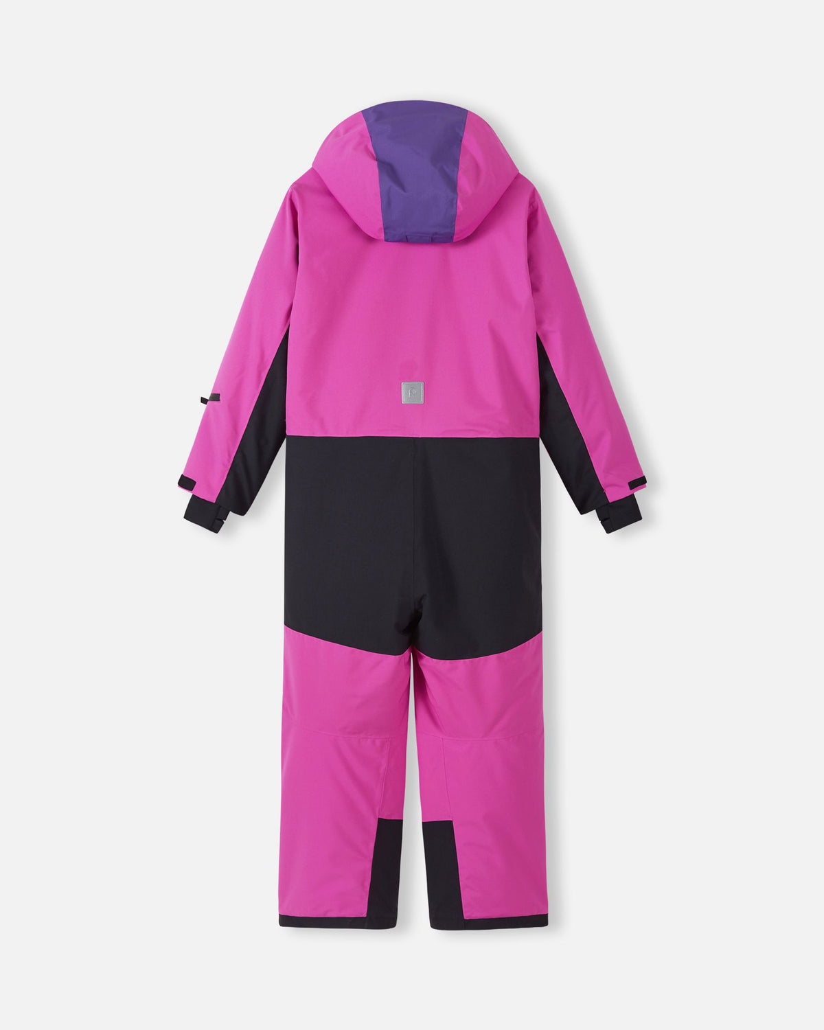 Back view of the Reima Skaulo girls ski suit in fuchsia, highlighting the protective, heavy-duty black reinforcement on the seat and lower legs designed for active snow play.