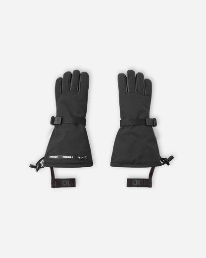 Flat lay view of the backs of the classic black Reima Skimba kids' ski gloves, featuring an extra-long snow-blocking gauntlet cuff, an adjustable wrist strap, and elastic safety wrist leashes.