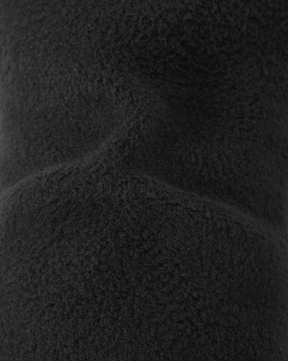 Macro close-up of the soft, thick black thermal fleece inner lining inside the Reima Skimba kids' ski gloves, engineered to provide maximum warmth and comfort during cold weather winter sports.