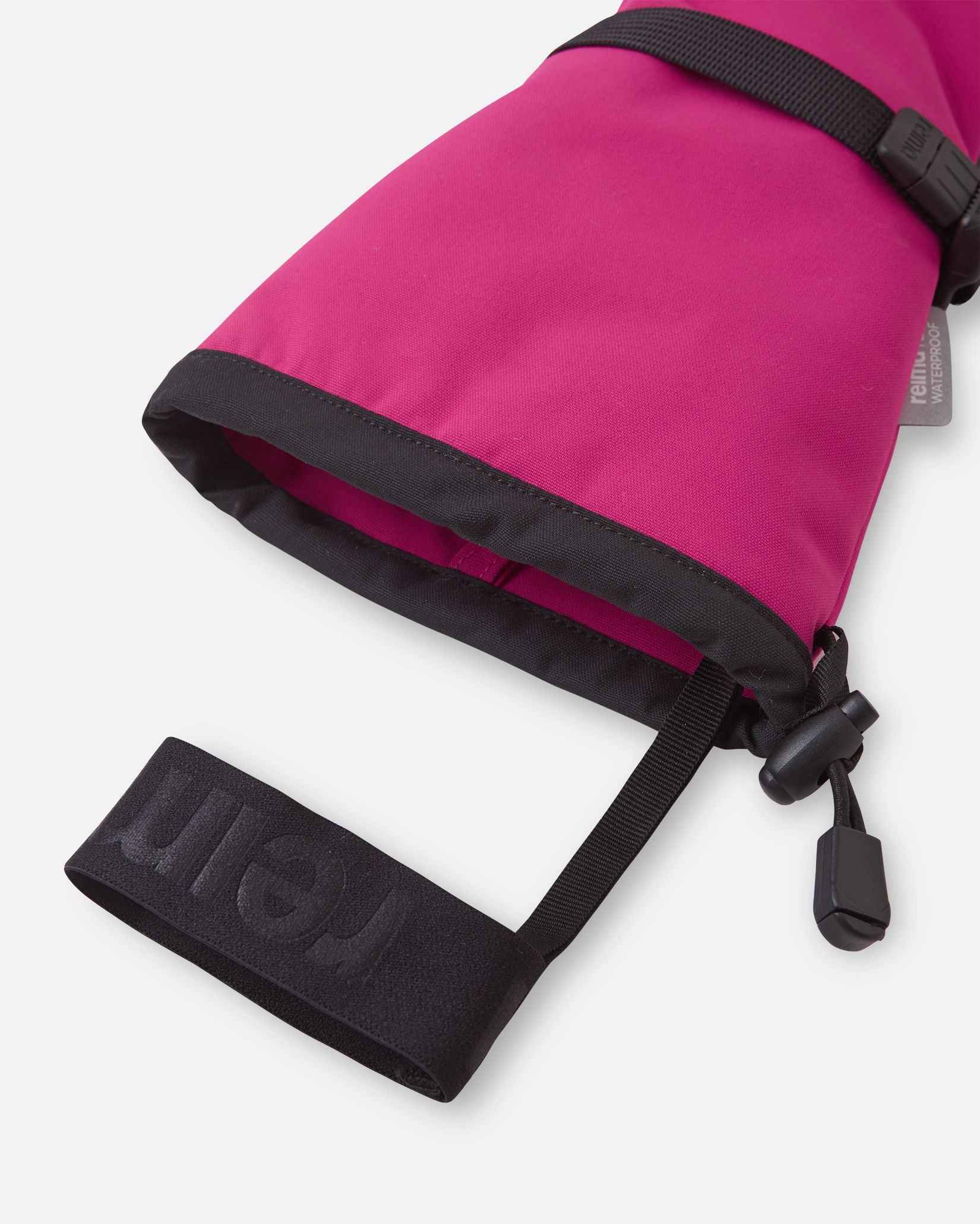 Close-up detail of the extra-long cuff opening on the rosy berry pink Reima Skimba kids' ski gloves, highlighting the attached elastic safety wrist leash designed to prevent dropped gear on the chairlift.