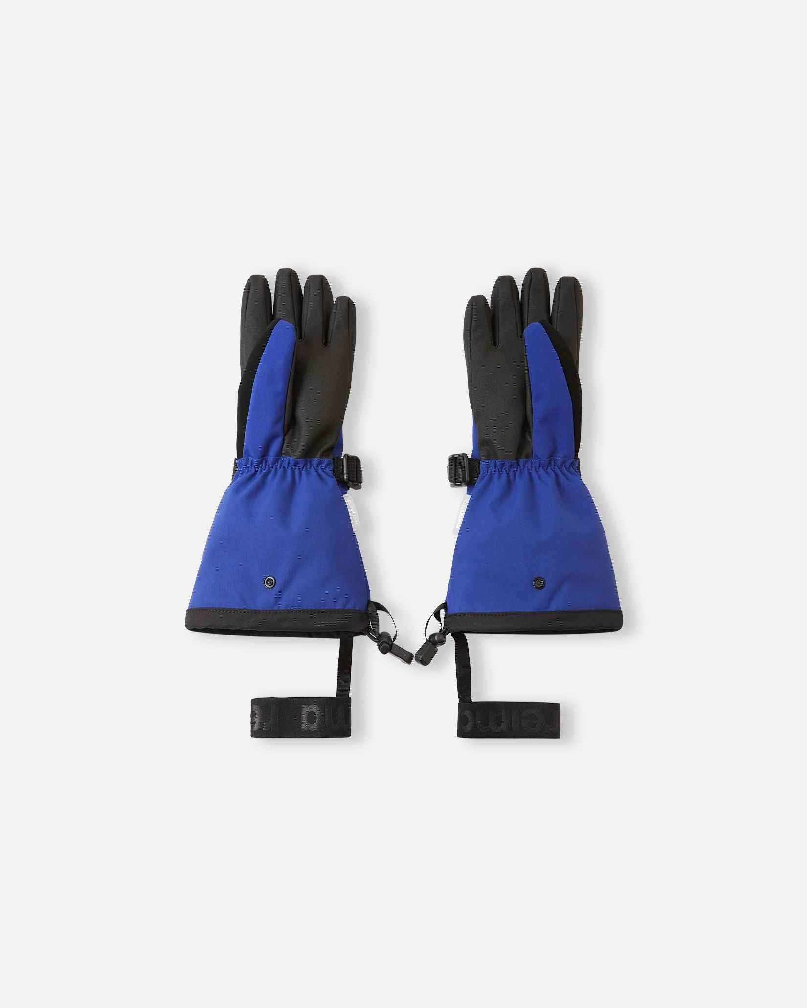 Flat lay view of the palms of the twilight blue Reima Skimba kids' ski gloves, showcasing the durable black reinforced gripping surface on the fingers and palms designed for securely holding ski poles.
