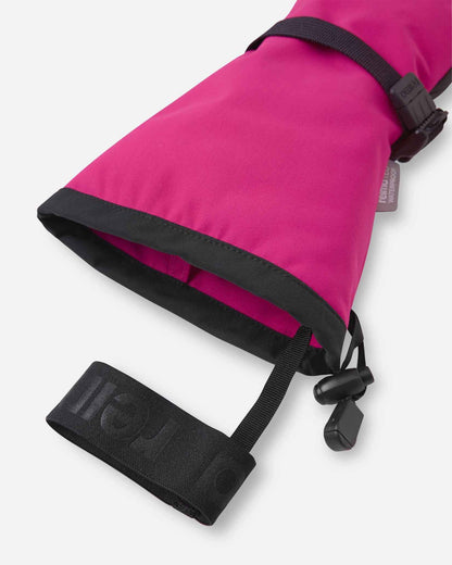 Close-up detail of the extra-long cuff opening on the rosy berry pink Reima Snoukka kids' ski mittens, highlighting the attached elastic safety wrist leash designed to prevent dropped gear on the mountain.