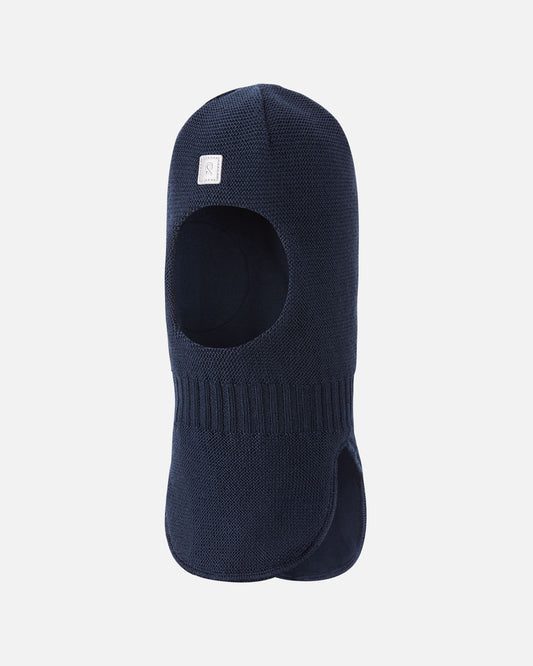 Angled side profile of the navy Reima Starrie kids' breathable neck warmer and balaclava, highlighting the contoured shoulder drape designed to lay flat against the collarbone.