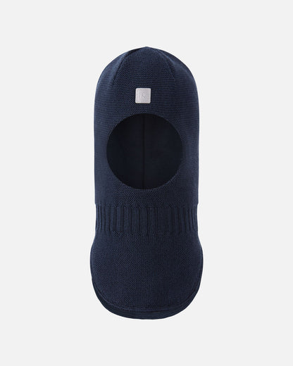 Full front view of the navy blue Reima Starrie toddler merino wool ski mask, showing the soft face opening and extended chest panel for optimal winter thermal protection.
