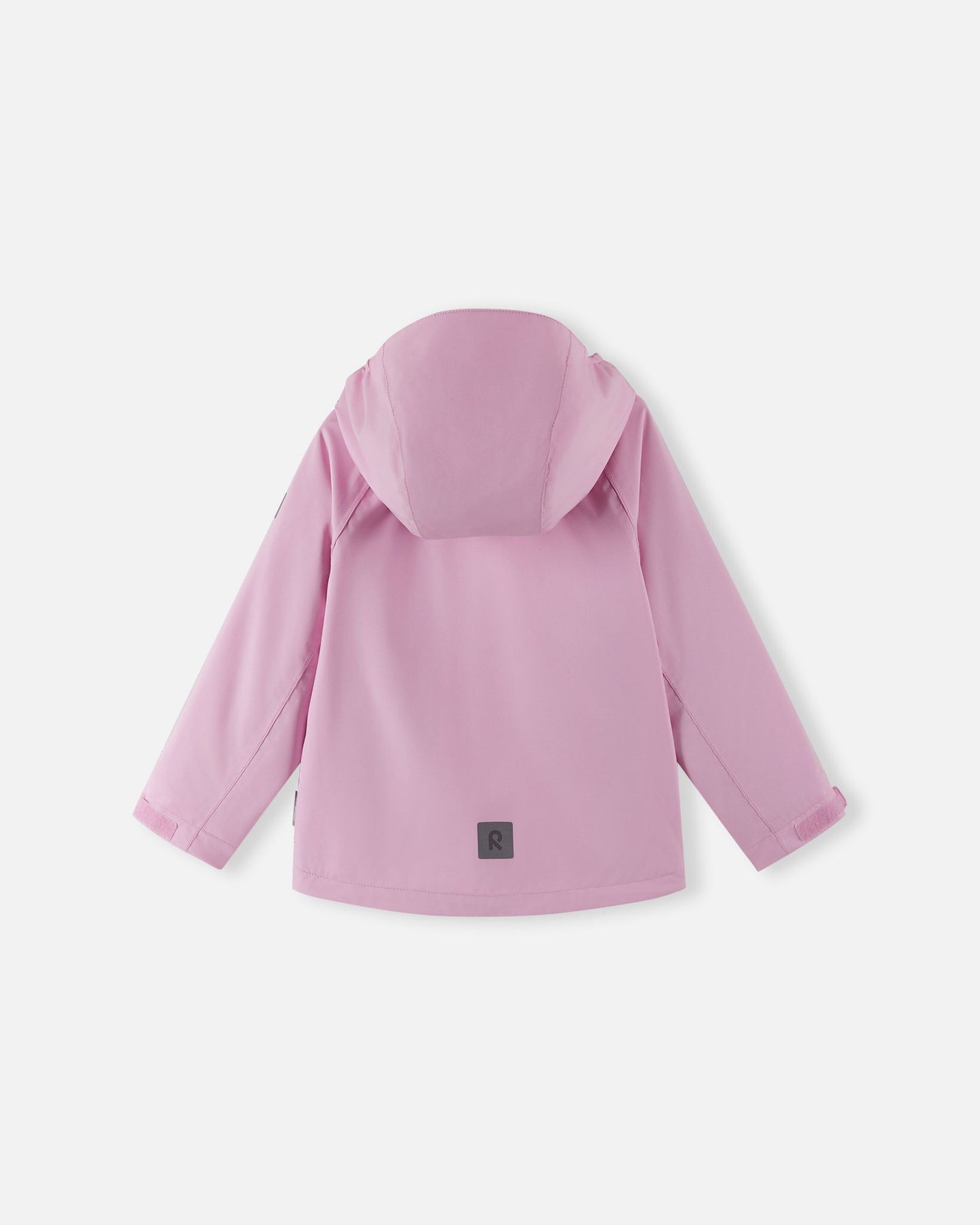 Back view of the Reima Sulkava girls' fall jacket in light heather pink, featuring an attached hood and a reflective safety patch near the bottom hem for high visibility during dark autumn evenings.
