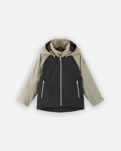 Front view of the Reima Sulkava kids' fall jacket featuring a color-block design with a black body and beige sleeves and hood, equipped with a full zipper, two side pockets, and a protective weather hood.