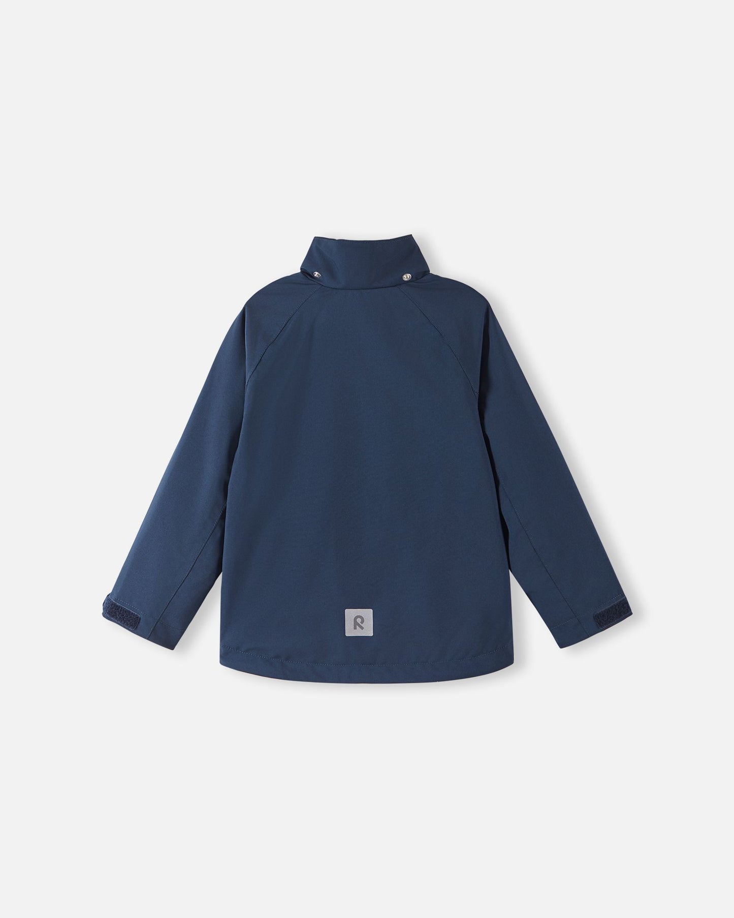 Back view of the navy blue Reima Sulkava kids' fall jacket with the detachable hood unfastened, showing the high stand collar that shields the neck from cold autumn breezes.