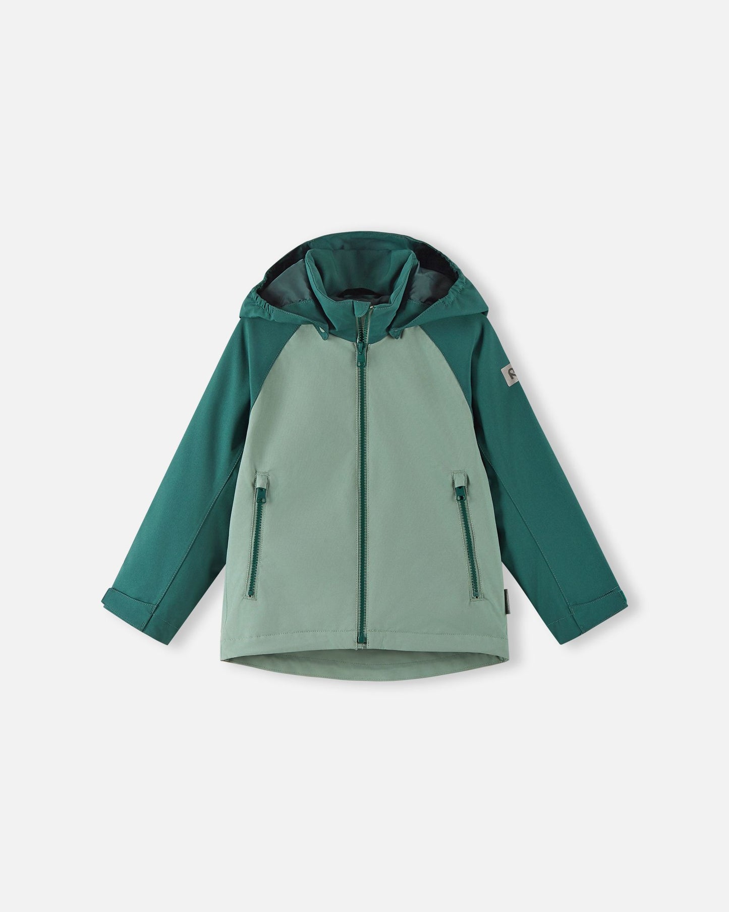 Front view of the Reima Sulkava kids' fall jacket featuring a color-block design in light and dark stone green, equipped with a full-length zipper, two side pockets, and a protective weather hood.