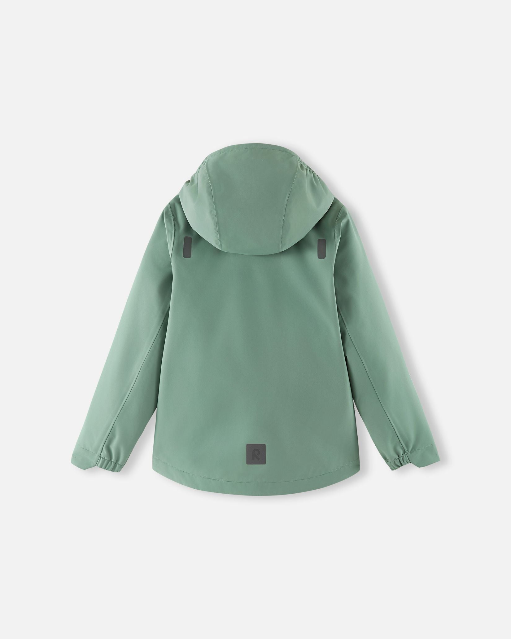 Back view of the stone green Reima Suojala kids' shell jacket, showcasing the protective hood, a longer drop-tail hem for extra coverage, and reflective safety patches for enhanced visibility.