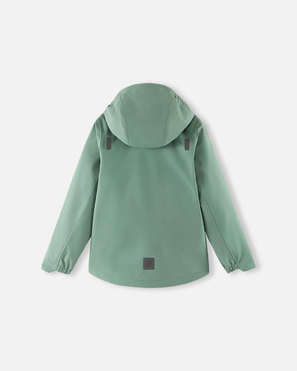 Back view of the stone green Reima Suojala kids' shell jacket, showcasing the protective hood, a longer drop-tail hem for extra coverage, and reflective safety patches for enhanced visibility.