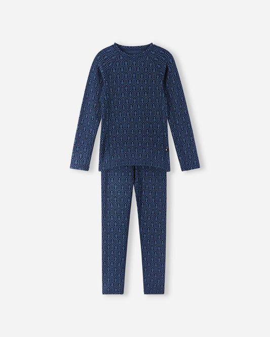 Front flat lay view of the navy blue Reima Taival kids' merino wool base layer set, featuring a long-sleeve thermal top and matching leggings adorned with a geometric forest pattern for optimal winter warmth.