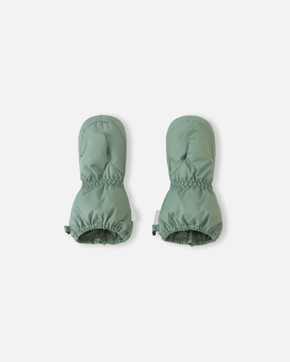 Palm side view of the stone green Reima Tassuin toddler winter mittens, highlighting the durable woven exterior, tailored thumb inserts, and stretchy elastic cuffs designed for a secure fit on small hands.