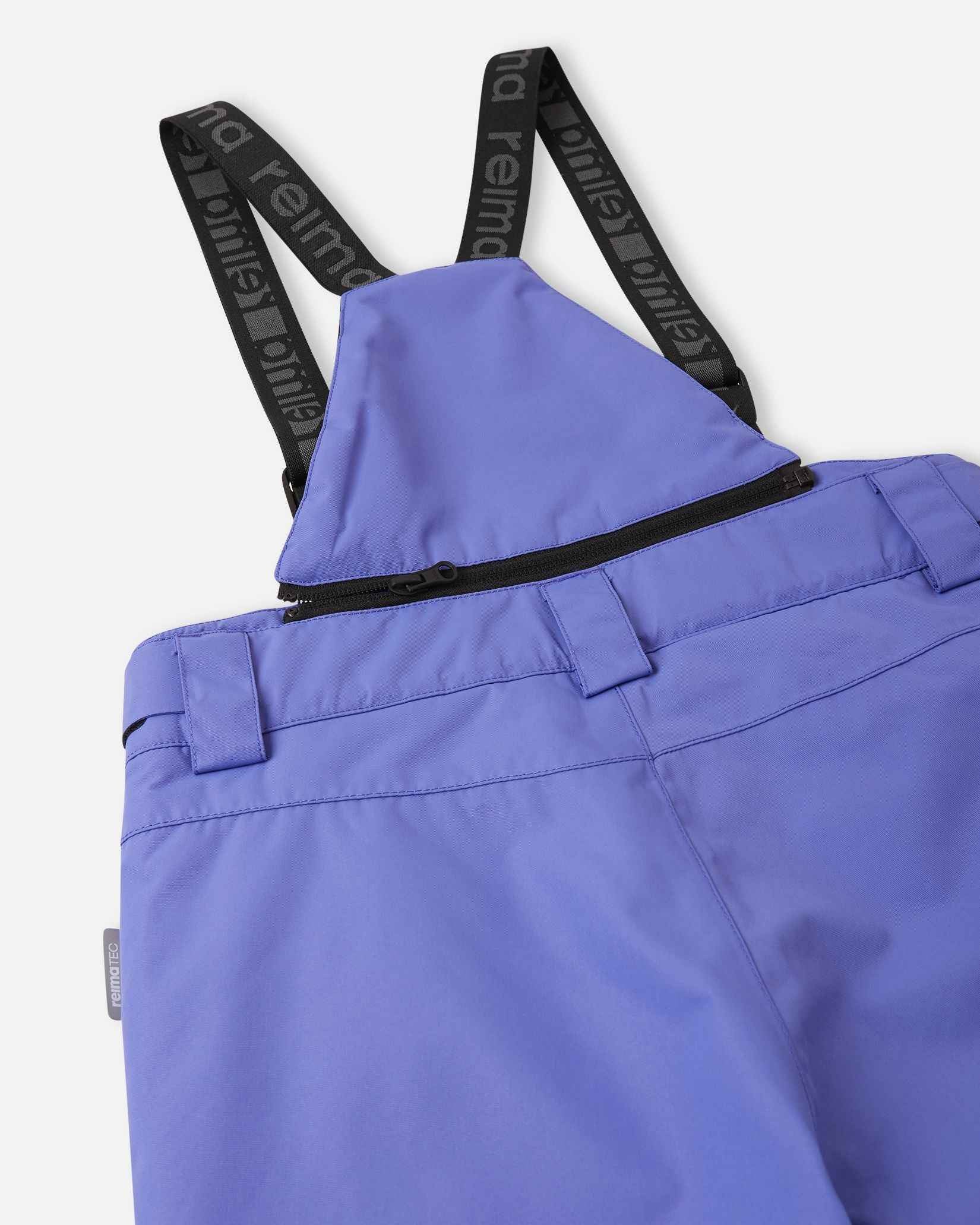 Detail view of the upper back on the breezy violet Reima Terrie kids' snow pants, featuring the stretchy high-back panel for extra core warmth, belt loops, and sturdy Reima-branded elastic suspenders.