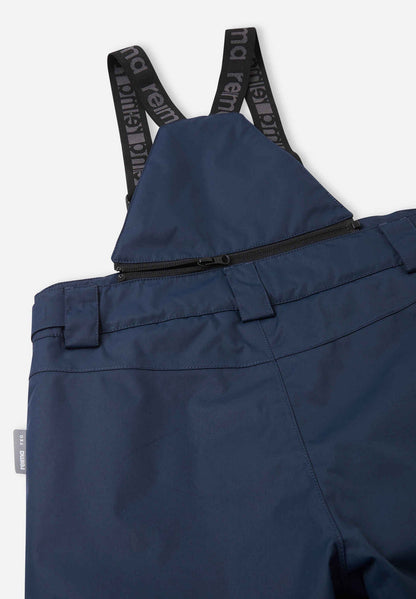 Detail view of the upper back on the navy blue Reima Terrie kids' snow pants, featuring the stretchy high-back panel for extra core warmth, belt loops, and sturdy Reima-branded elastic suspenders.
