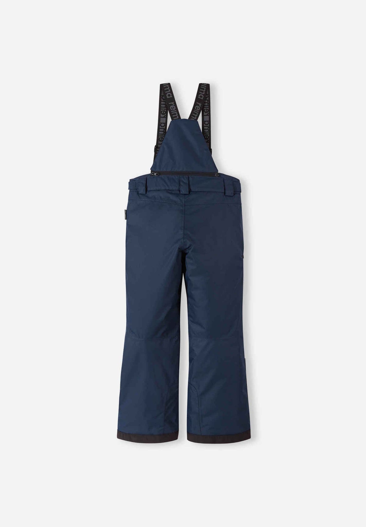 Back flat lay view of the navy blue Reima Terrie kids' ski pants, showcasing the high-back coverage, elastic waistband, and heavy-duty black reinforced lower legs built for rugged winter sports.