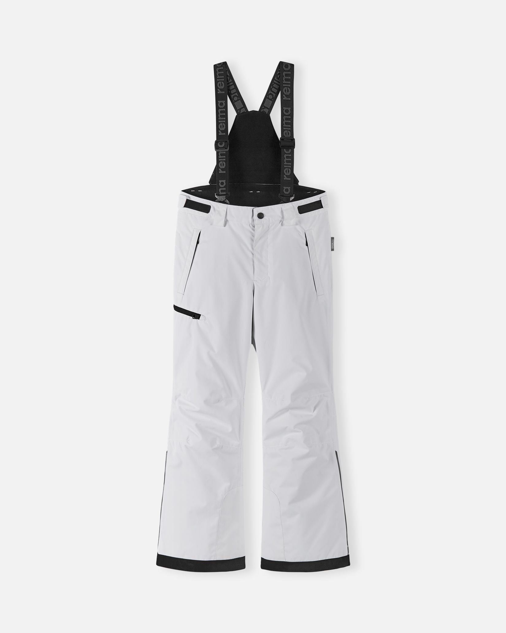 Front flat lay view of the crisp white Reima Terrie kids' winter snow ski pants, featuring adjustable Reima-branded black suspenders, a zippered thigh pocket, and durable waterproof construction designed for alpine skiing and snowboarding.