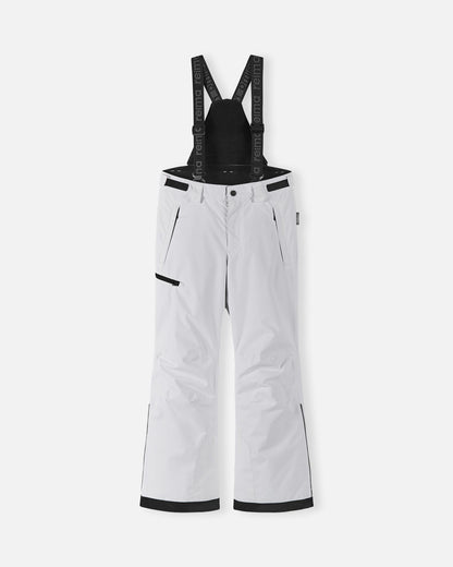Front flat lay view of the crisp white Reima Terrie kids' winter snow ski pants, featuring adjustable Reima-branded black suspenders, a zippered thigh pocket, and durable waterproof construction designed for alpine skiing and snowboarding.