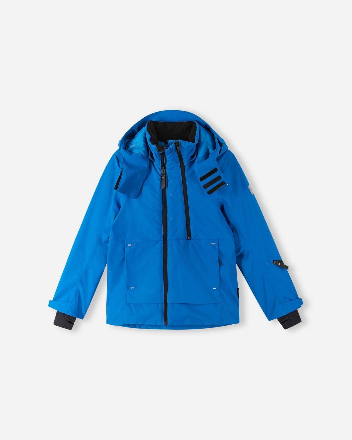 Front flat lay layout of the vibrant bright blue Reima Tieten boys' winter snow jacket, featuring a Reimatec waterproof shell, bold black accent zippers, and a detachable alpine hood designed for winter sports.