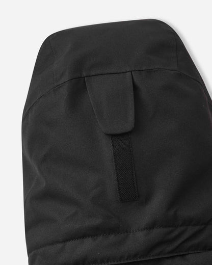 The back of the black Reima Tieten winter jacket features a large hood to protect children from wind and snow.
