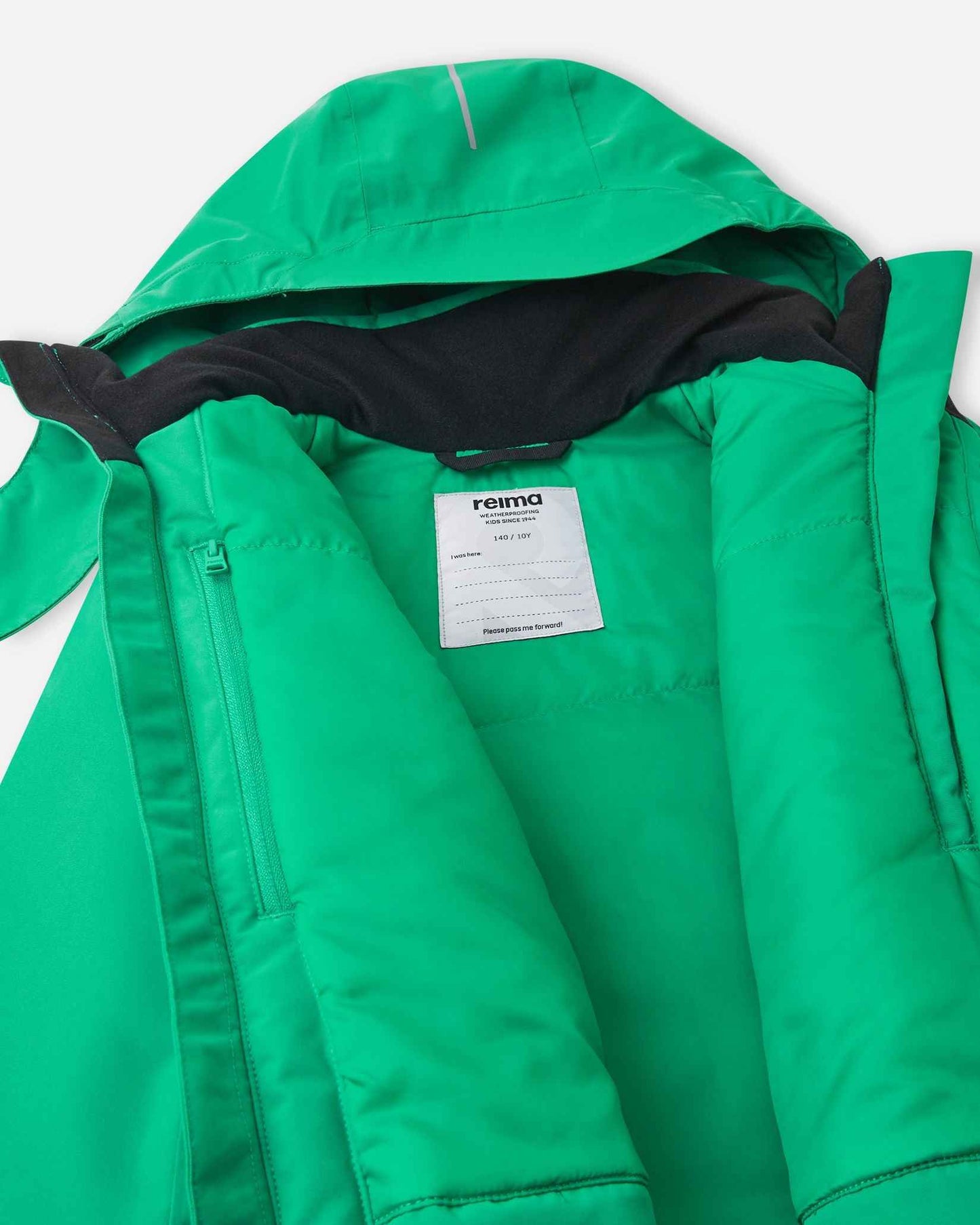 The back of the bright green jacket hood hangs down to show the dark internal collar and hanging loop.