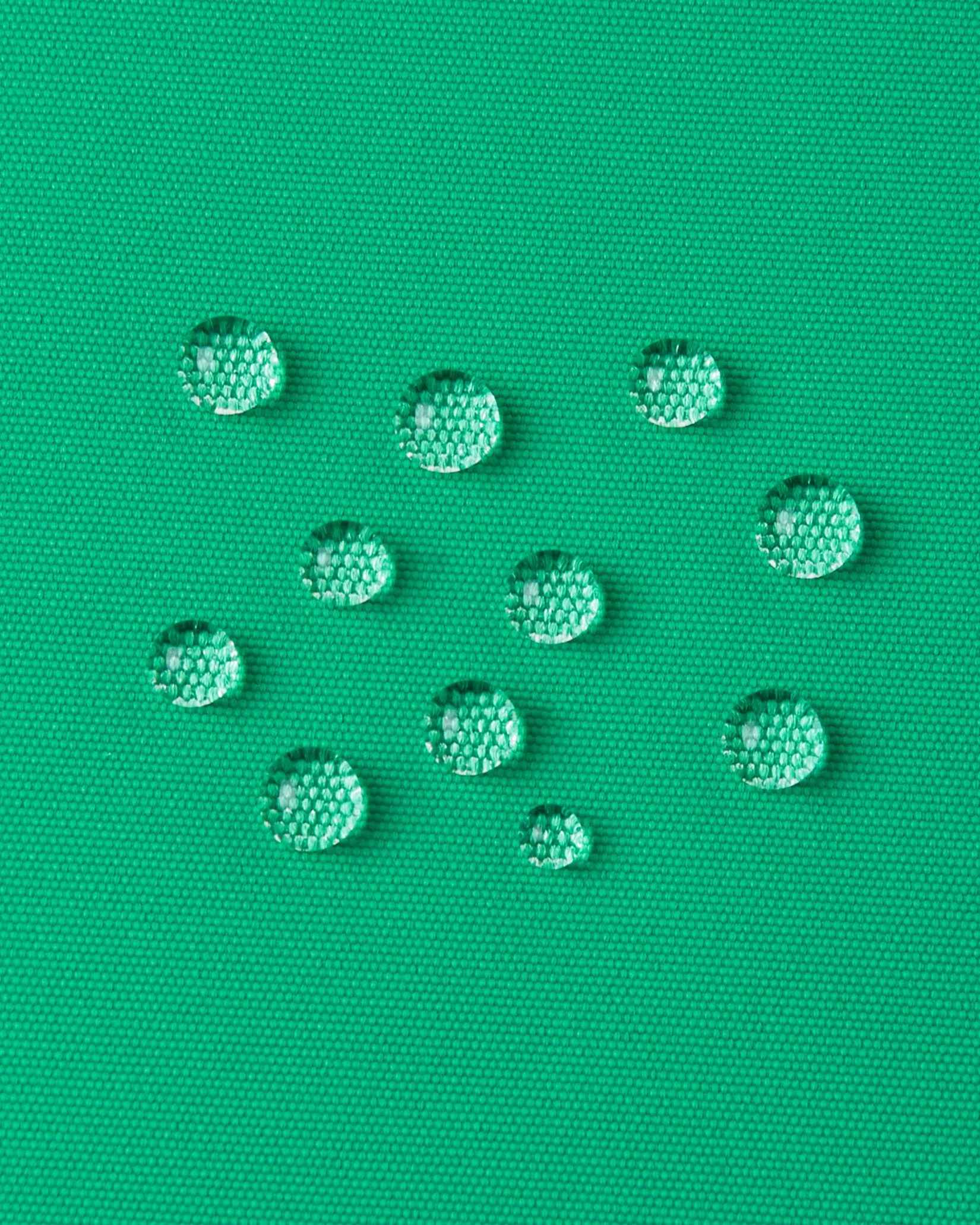 Drops of water sit on the green outer material of the Reima winter jacket.