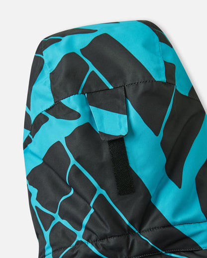 Detail view of the adjustable velcro strap on the back of the hood of the black Reima Tirro kids' waterproof winter ski jacket, designed for a customized, secure fit.