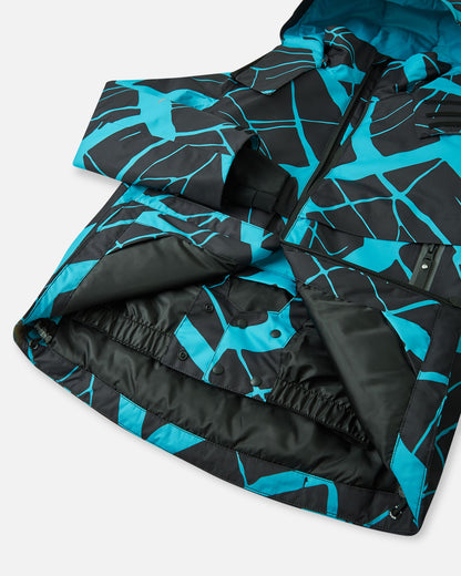 Open front view of the black Reima Tirro kids' ski jacket, highlighting the internal snap-button powder skirt designed to keep out snow and cold drafts during winter sports.