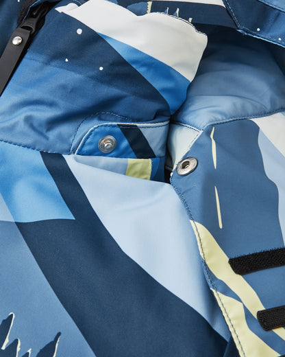 Close-up of the soft, protective chin guard and secure collar snap buttons on the ocean blue Reima Tirro kids' waterproof ski jacket.