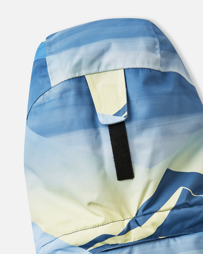 Close-up of the secure velcro hood attachment tab on the back collar of the ocean blue Reima Tirro kids' winter ski jacket.