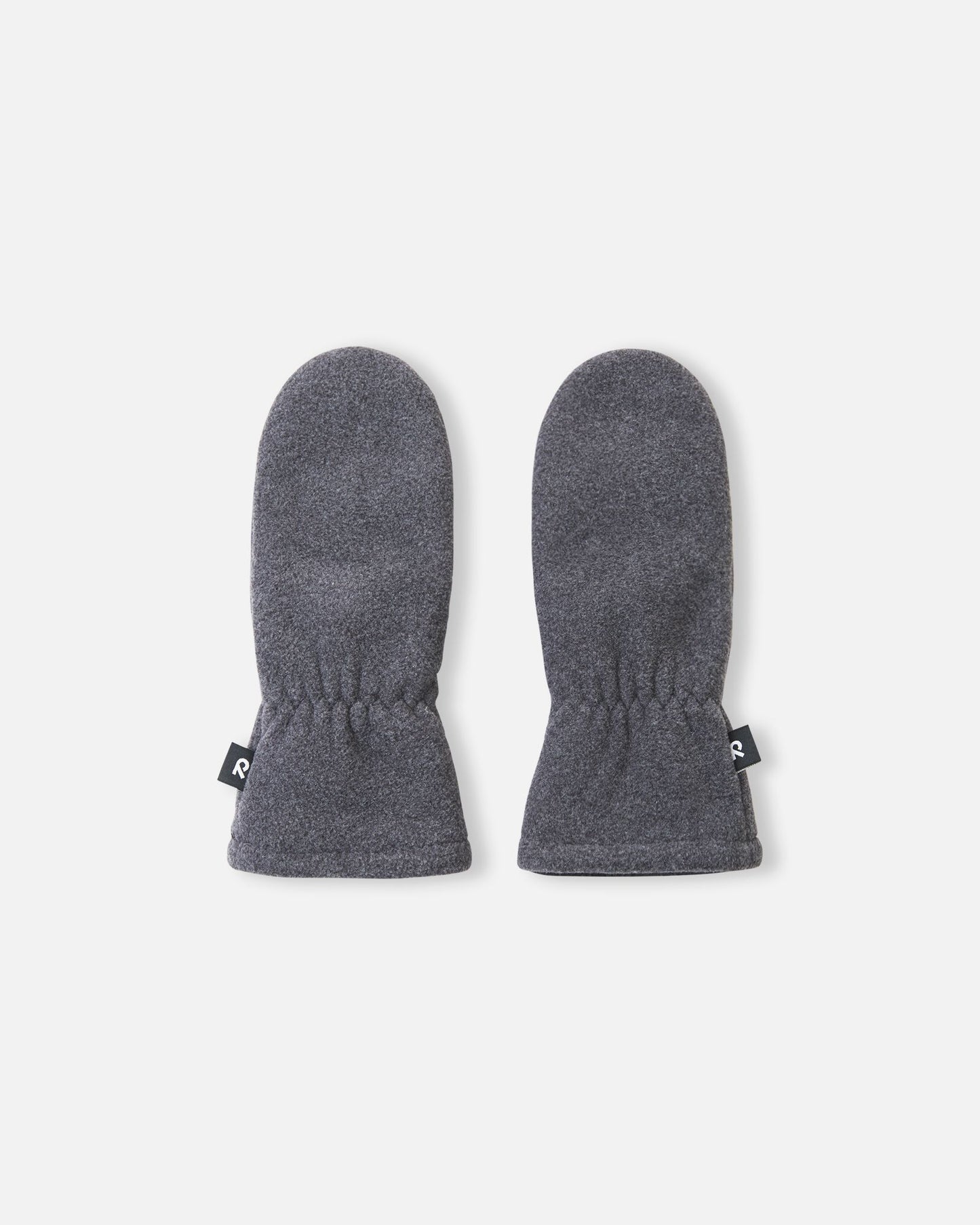 Flat lay view of the backs of the black melange Reima Tumpus kids' fleece mittens, highlighting the cozy winter material and elasticized wrists designed to keep cold air out.