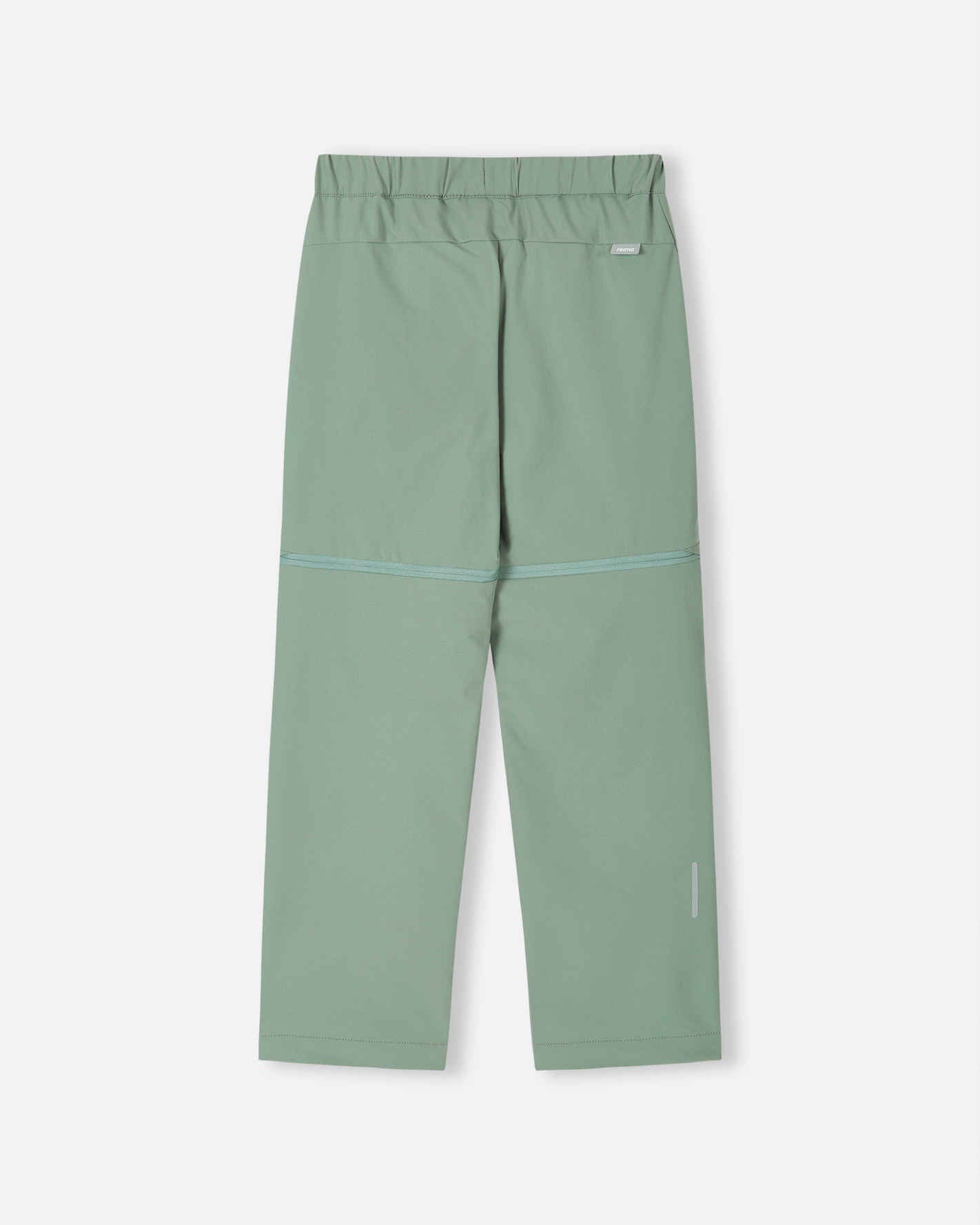 Back view of the stone green Reima Tuplat kids' hiking pants, showcasing the durable, stretch outdoor fabric, clean back profile, and a reflective safety detail on the lower right leg for trail visibility.