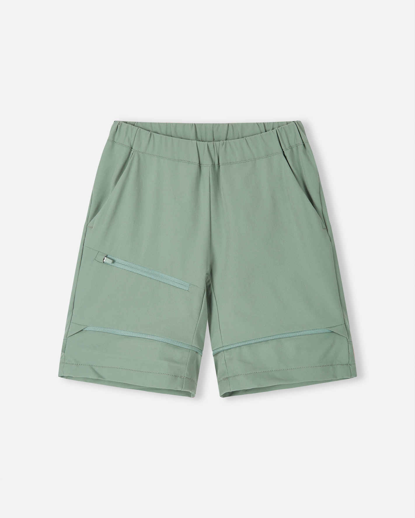 Front view of the Reima Tuplat kids' hiking pants converted into stone green shorts, highlighting the versatile zip-off design, relaxed fit, and practical zippered cargo pocket for warm weather hiking.