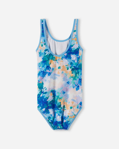 Back view of the cool blue Reima Uimaan girls' watercolor swimsuit, demonstrating the athletic scoop back profile designed for active beach days and comfortable all-day wear.