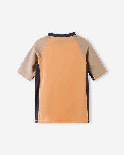 Back view of the apricot Reima Uiva kids' UPF 50+ swim shirt, highlighting the seamless shoulder construction that provides excellent mobility and prevents chafing during water play.