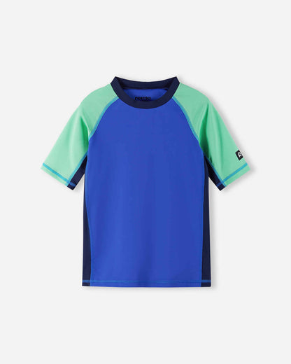 Front view of the Reima Uiva kids' UPF 50+ sunproof rash guard in sparkly blue, featuring a stylish color block design with mint green short sleeves and dark navy side panels for premium sun protection.