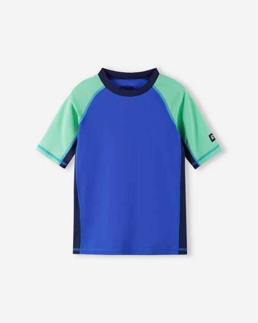 Front view of the Reima Uiva kids' UPF 50+ sunproof rash guard in sparkly blue, featuring a stylish color block design with mint green short sleeves and dark navy side panels for premium sun protection.