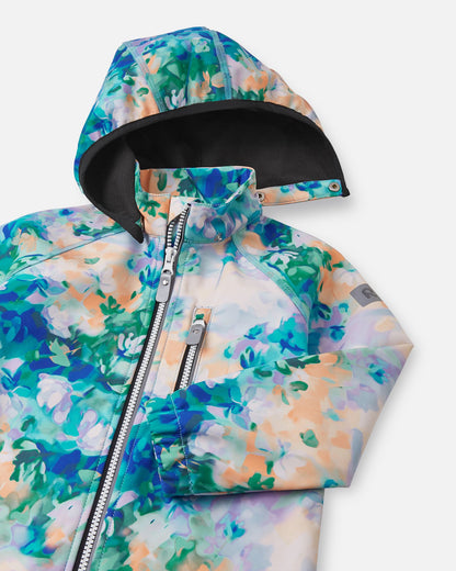 Close-up of the hood and high collar on the fresh blue floral Reima Vantti kids' softshell jacket, showing the cozy, insulating black fleece lining that provides extra warmth without bulk.