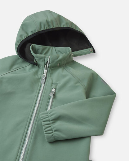 Close-up of the hood and collar on the stone green Reima Vantti kids' softshell jacket, showing the cozy black fleece lining designed to provide extra insulation without bulk.